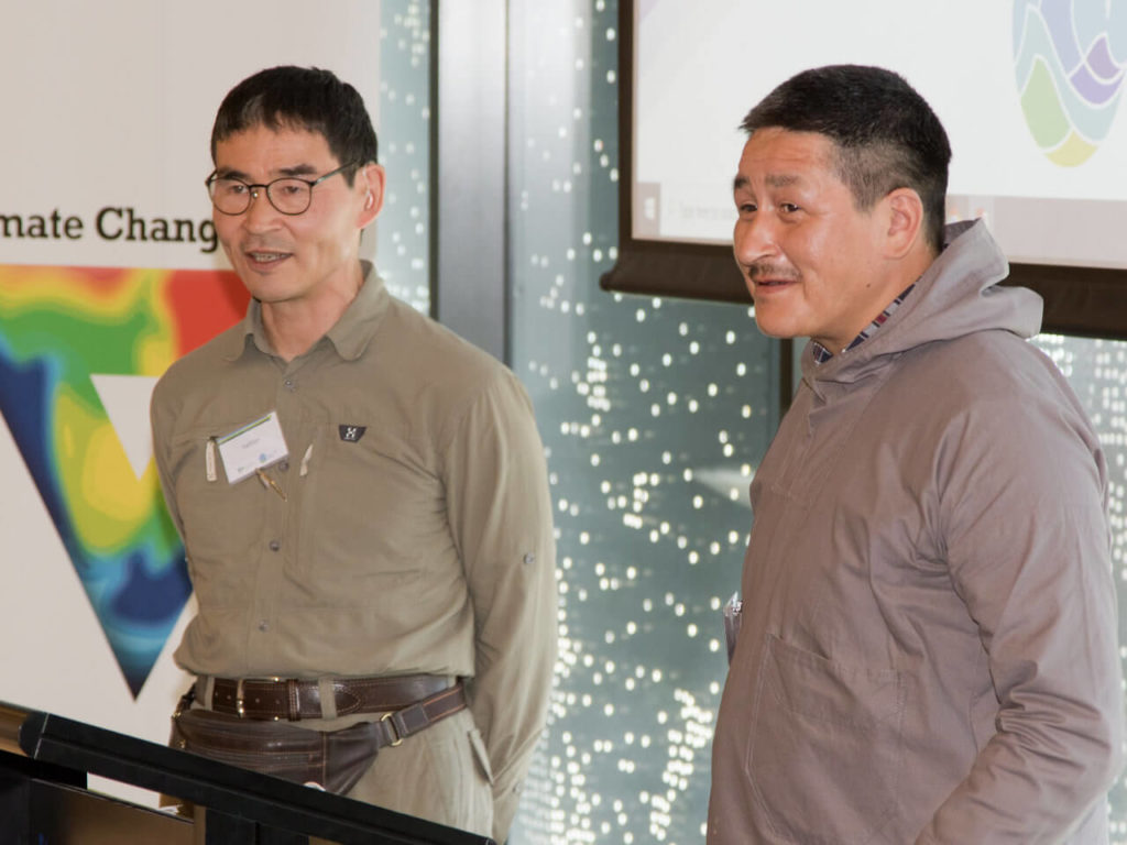 Two workshop participants speaking to the group