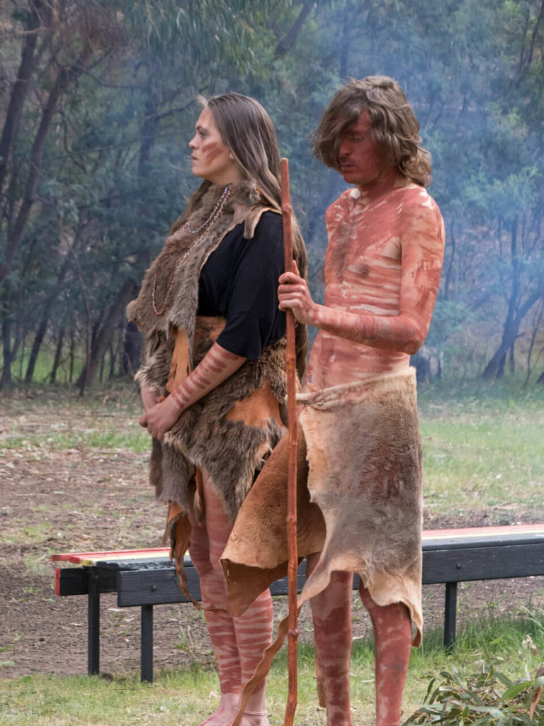 Two Aboriginal performers in traditional dress at the workshop welcome